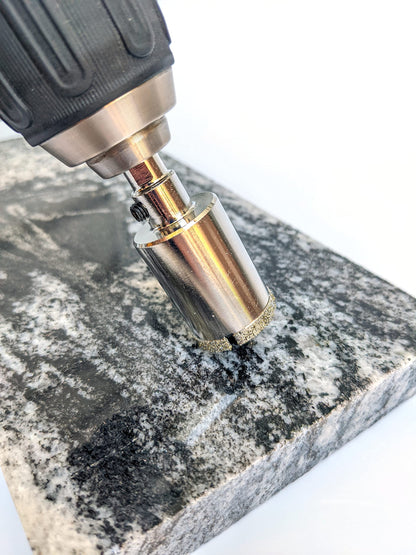 Drilling a granite countertop with a 1 inch diamond hole saw and cordless drill