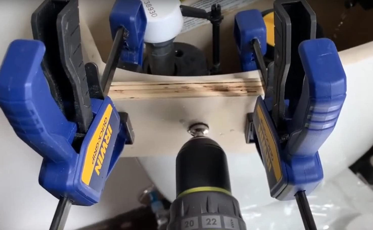 Drilling through a clamped scrap-wood guide