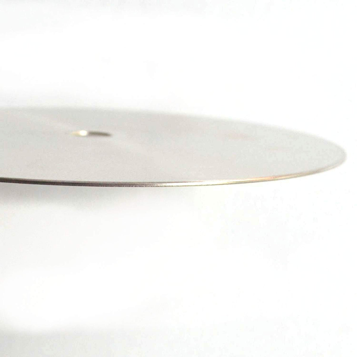 Thin, flat steel disc, side view