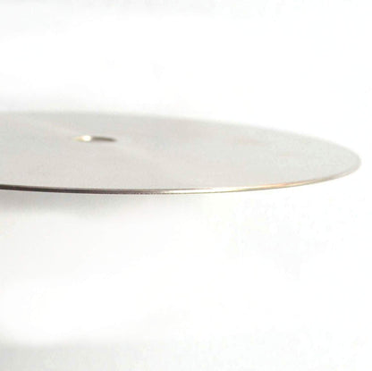 Thin, flat steel disc, side view
