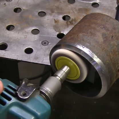 Angle grinder with flapper adapter sanding inside a steel pipe